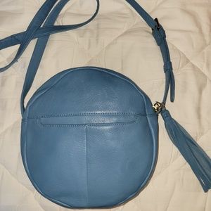 HOBO brand dusty blue round crossbody handbag.